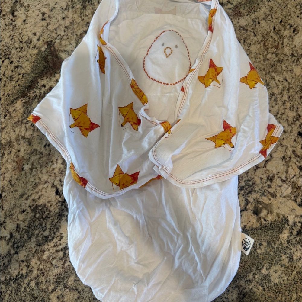 Nested Bean White Zen Swaddle with Yellow Logo Accent